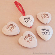 Gift a wooden heart with "I Miss You" sentiment, a thoughtful keepsake to send love and warm wishes.