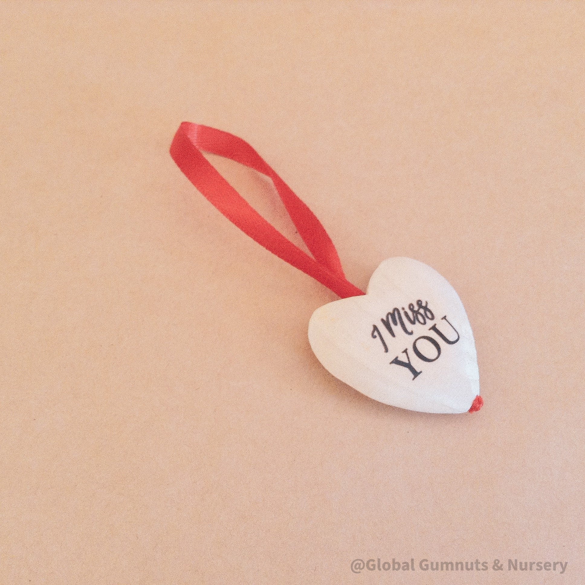 Gift a wooden heart with "I Miss You" sentiment, a thoughtful keepsake to send love and warm wishes.