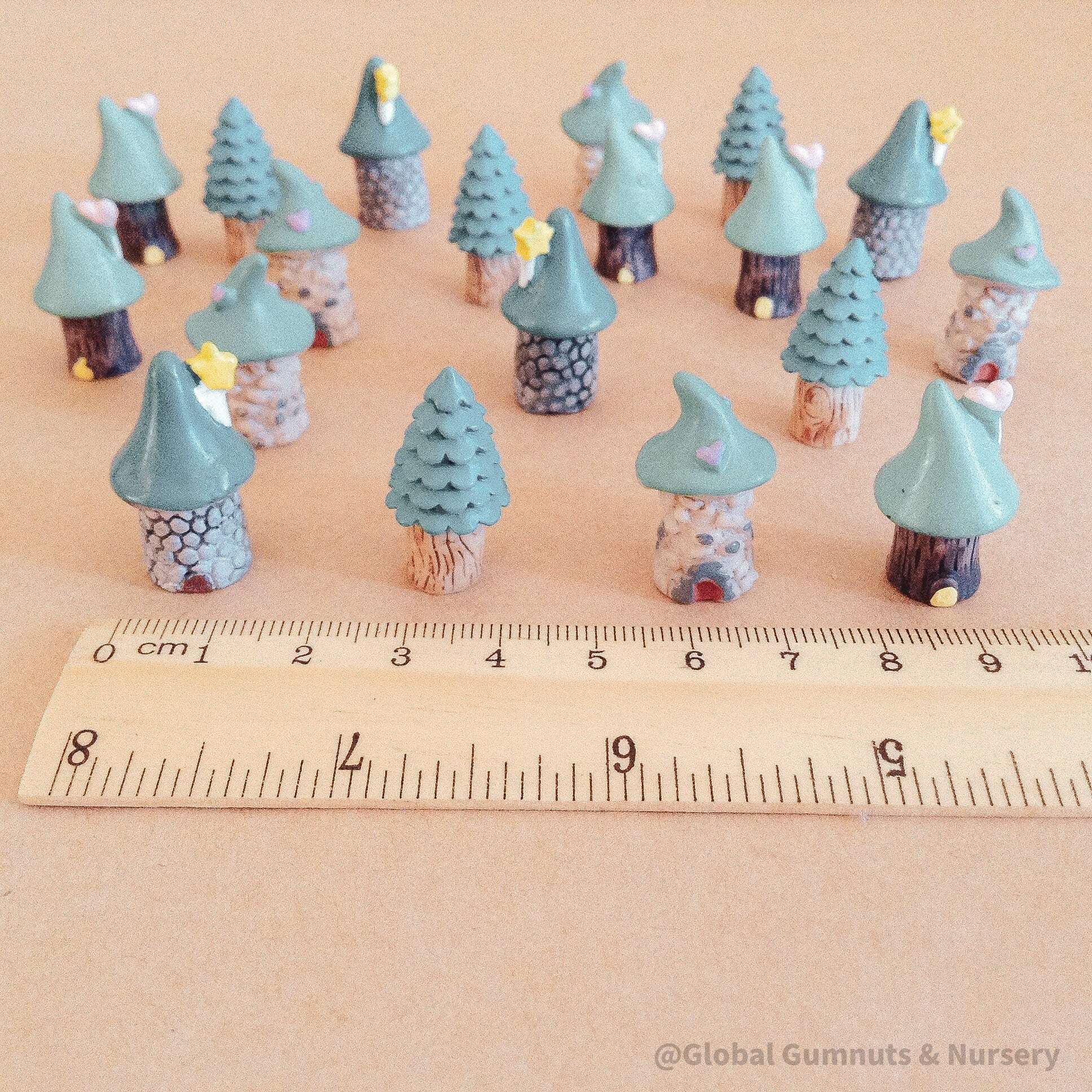 mini green tree fairy house figurines: whimsical resin treehouse figures for fairy gardens.