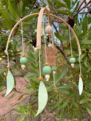 Koala Baby Mobile: Felt and wood nursery mobile featuring a koala.