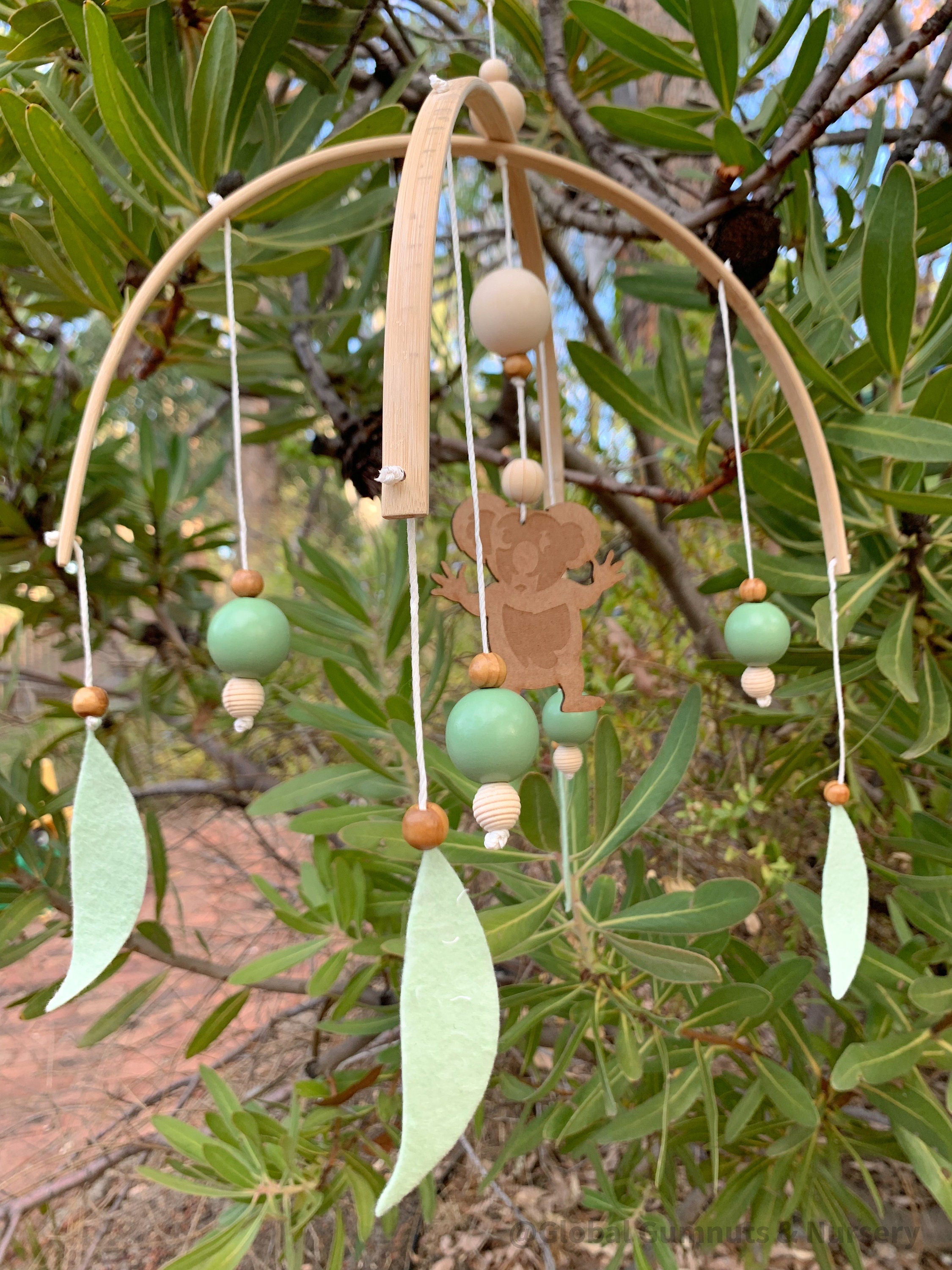 Koala Baby Mobile: Felt and wood nursery mobile featuring a koala.