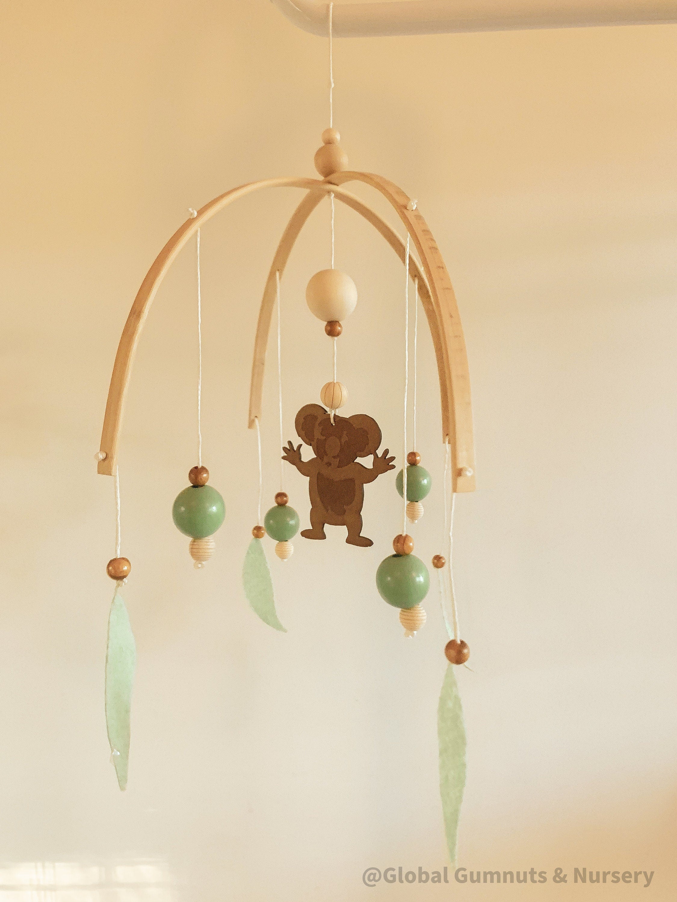 Koala Baby Mobile: Felt and wood nursery mobile featuring a koala.