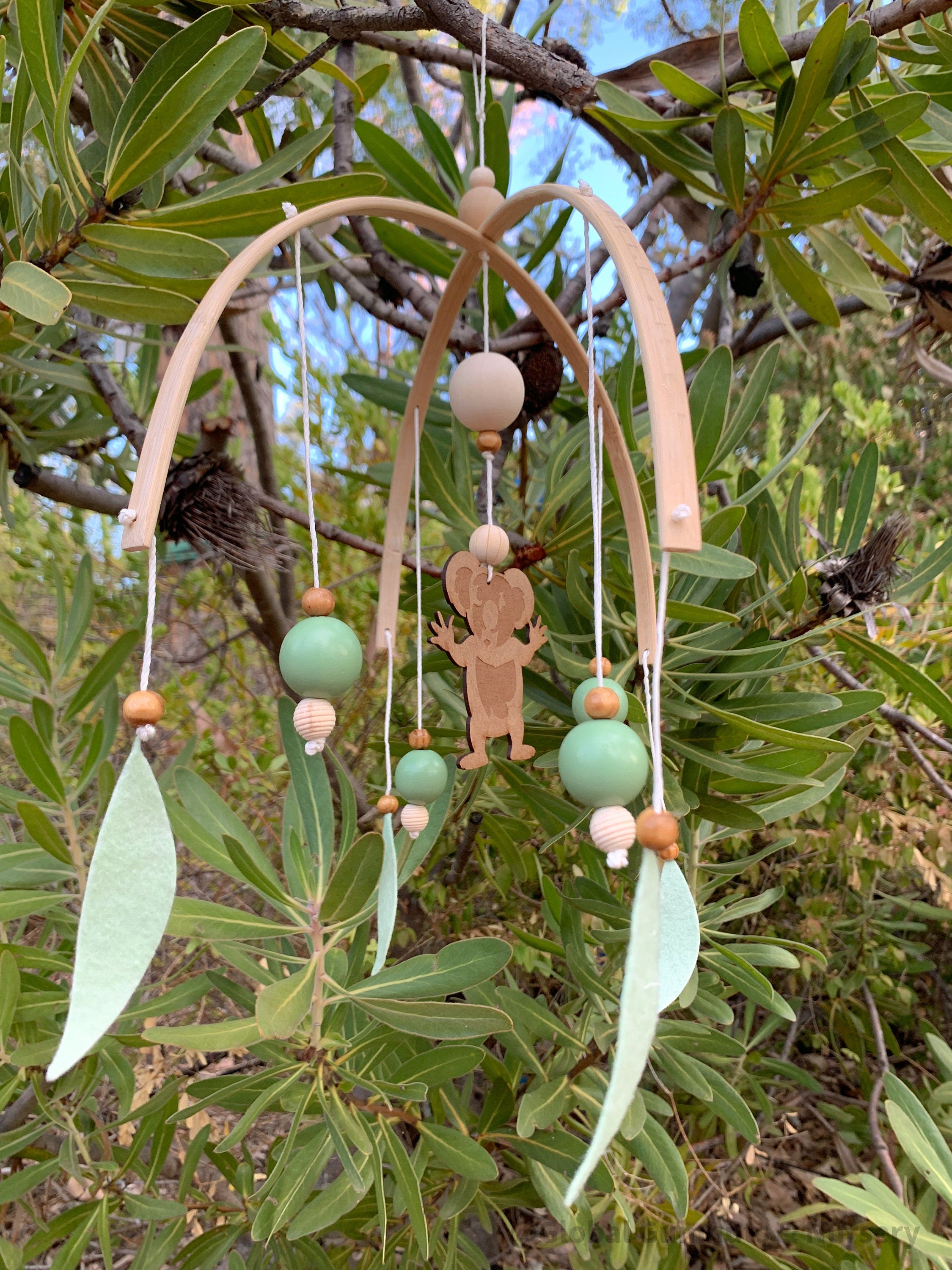 Koala Baby Mobile: Felt and wood nursery mobile featuring a koala.