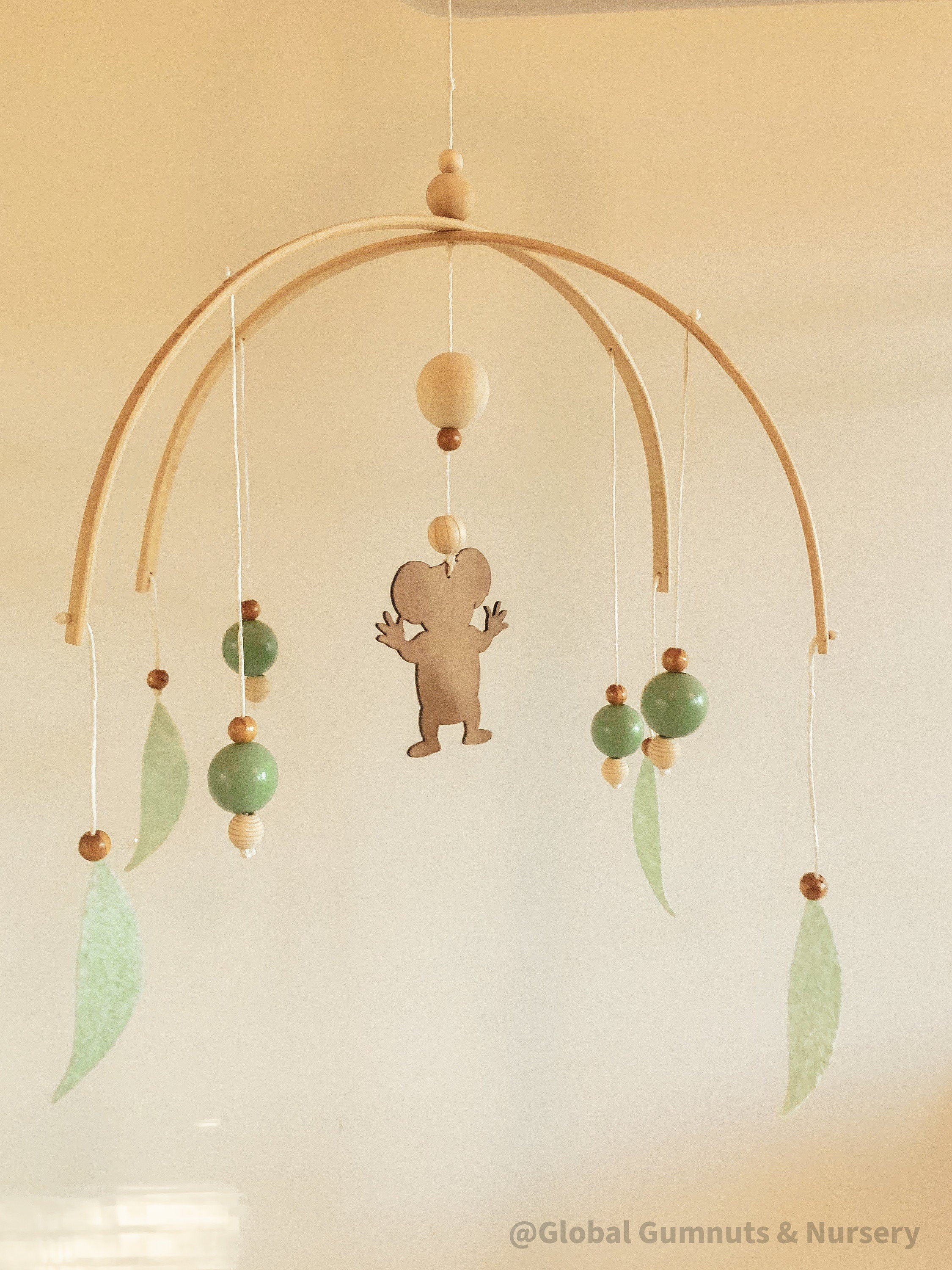 Koala Baby Mobile: Felt and wood nursery mobile featuring a koala.
