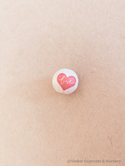 wooden love red heart beads: beautiful wooden beads with drilled holes in the shape of red hearts, perfect for diy craft projects and jewellery.