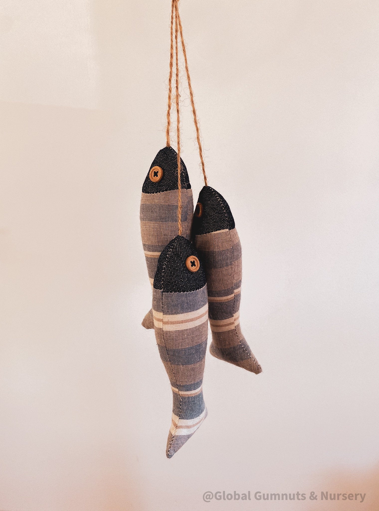 Seaside serenity ocean breeze fabric fish trio, a charming decor set.