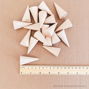 Natural mini wooden forest, featuring raw wooden Christmas trees for holiday crafts or decor.