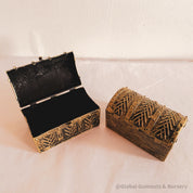 Golden plastic treasure chest, perfect for sparking kids' imaginations or treasure-themed adventures.