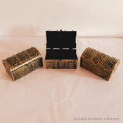 Golden plastic treasure chest, perfect for sparking kids' imaginations or treasure-themed adventures.