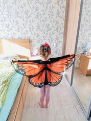 Vibrant butterfly wings for kids, custom chiffon designs with glitter and sparkle, perfect for dress-up or dance.