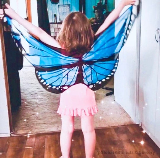 Vibrant butterfly wings for kids, custom chiffon designs with glitter and sparkle, perfect for dress-up or dance.