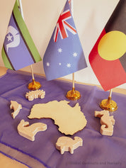 Australian Flag on Wooden Pole: Aboriginal and Australian flag set with optional felt balls.
