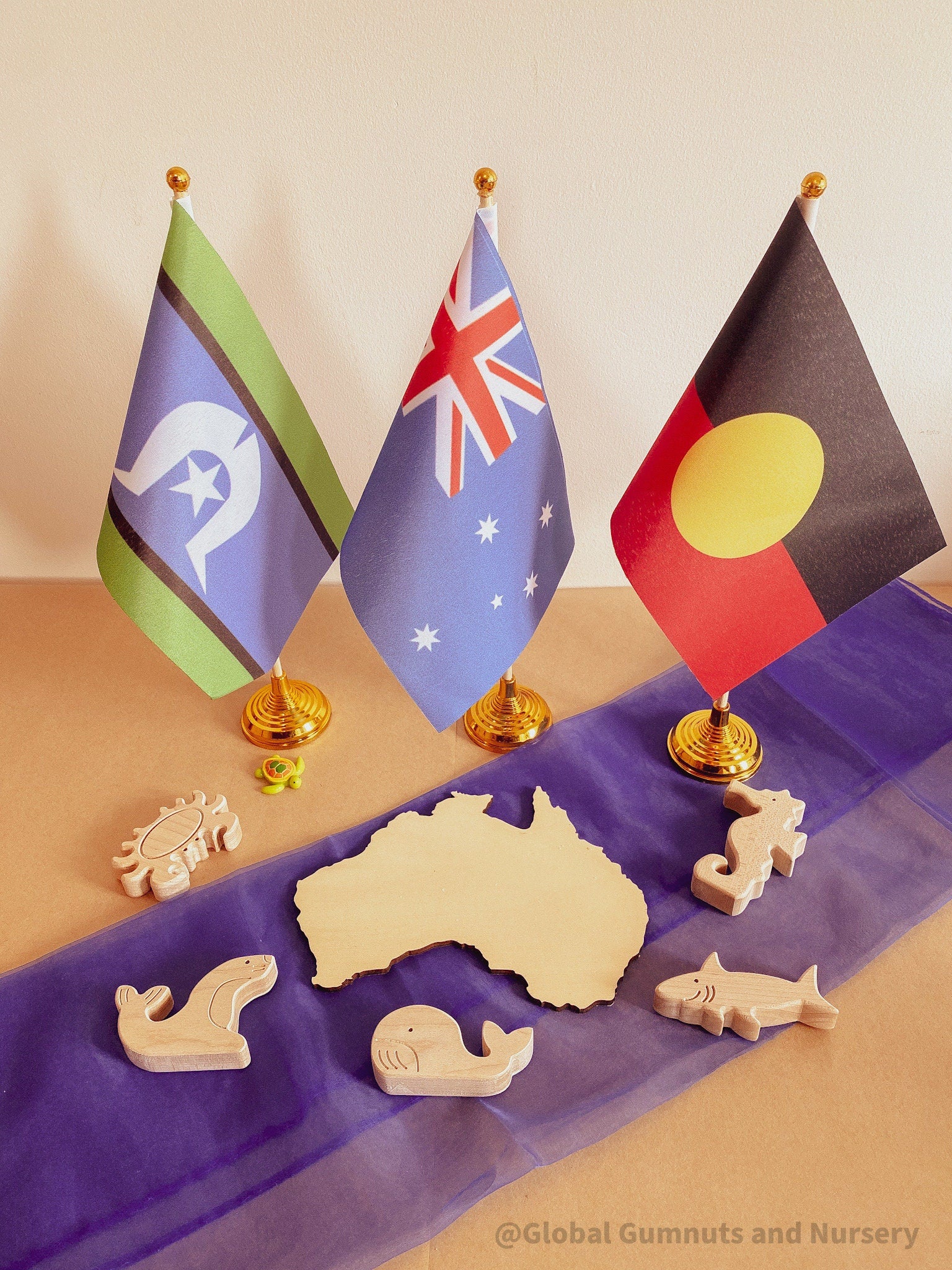 Australian Flag on Wooden Pole: Aboriginal and Australian flag set with optional felt balls.