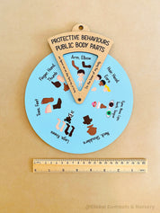 Interactive Protective Behaviours Spinner Dial: Educational wooden spinner with viewer window, teaching kids about personal body safety.