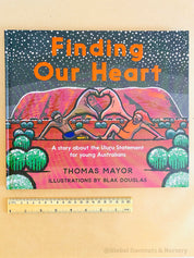 "Finding Our Heart" by Thomas Mayor, an Indigenous storytelling book paired with a wooden heart keepsake.