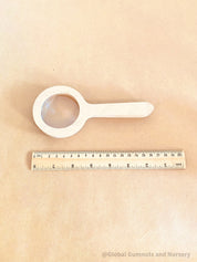 Kids' wooden magnifier, perfect for exploring nature and sparking curiosity in young adventurers.