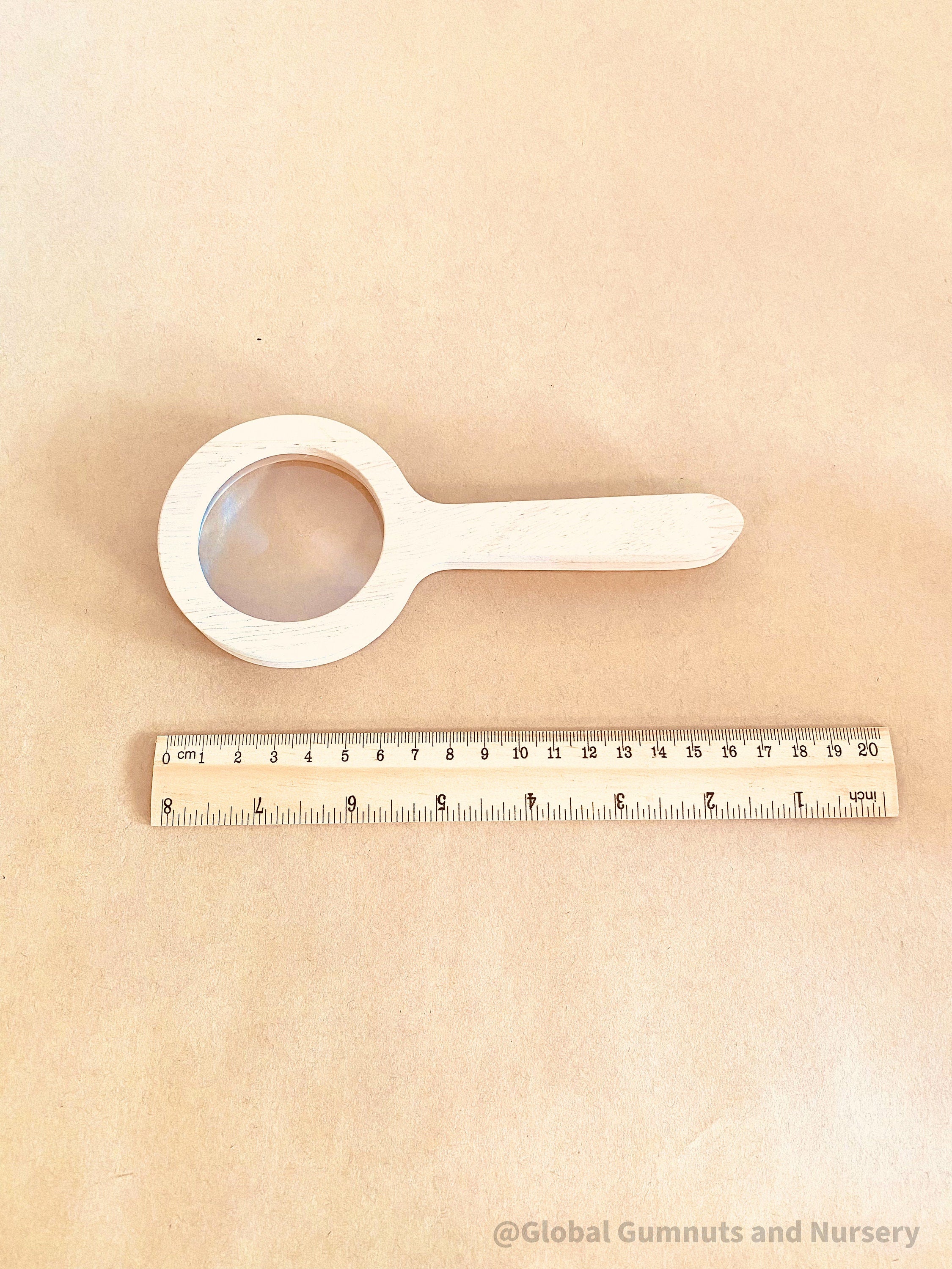 Kids' wooden magnifier, perfect for exploring nature and sparking curiosity in young adventurers.