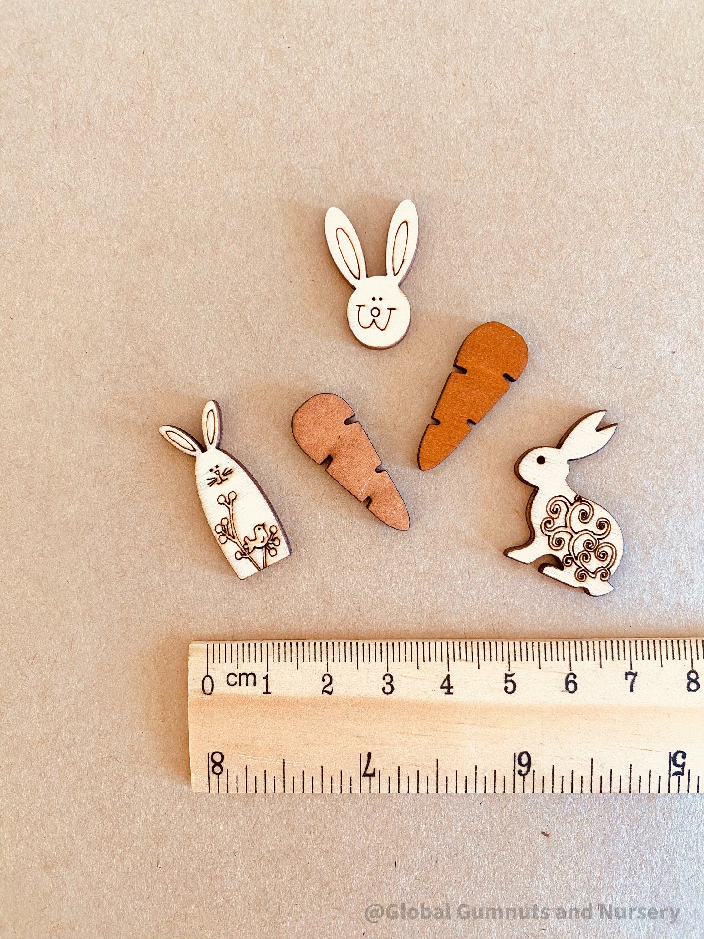 Easter Wooden Embellishments: Set of three bunnies and two carrots for Easter-themed crafts.