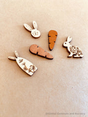 Easter Wooden Embellishments: Set of three bunnies and two carrots for Easter-themed crafts.