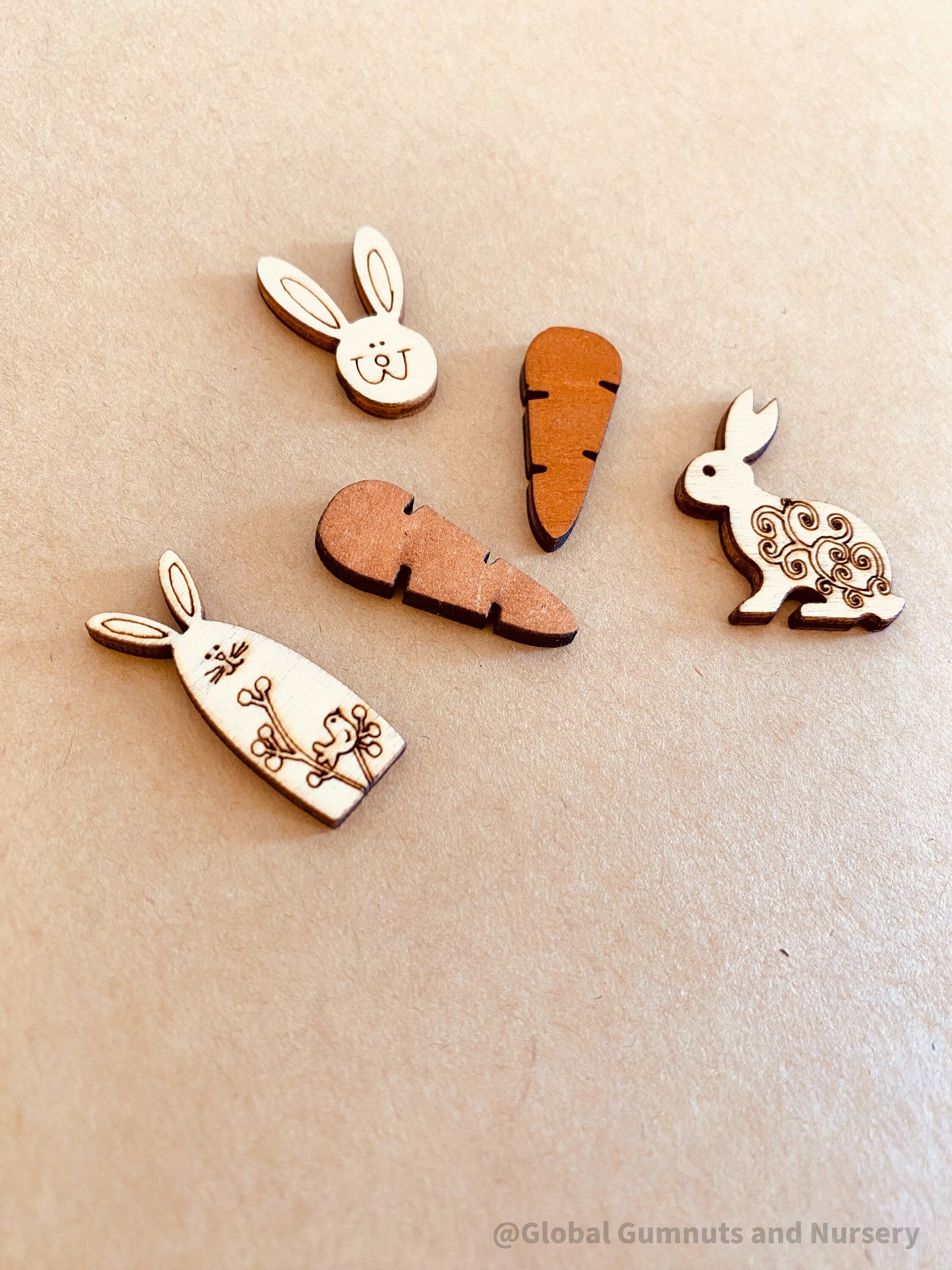 Easter Wooden Embellishments: Set of three bunnies and two carrots for Easter-themed crafts.