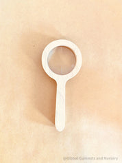 Kids' wooden magnifier, perfect for exploring nature and sparking curiosity in young adventurers.