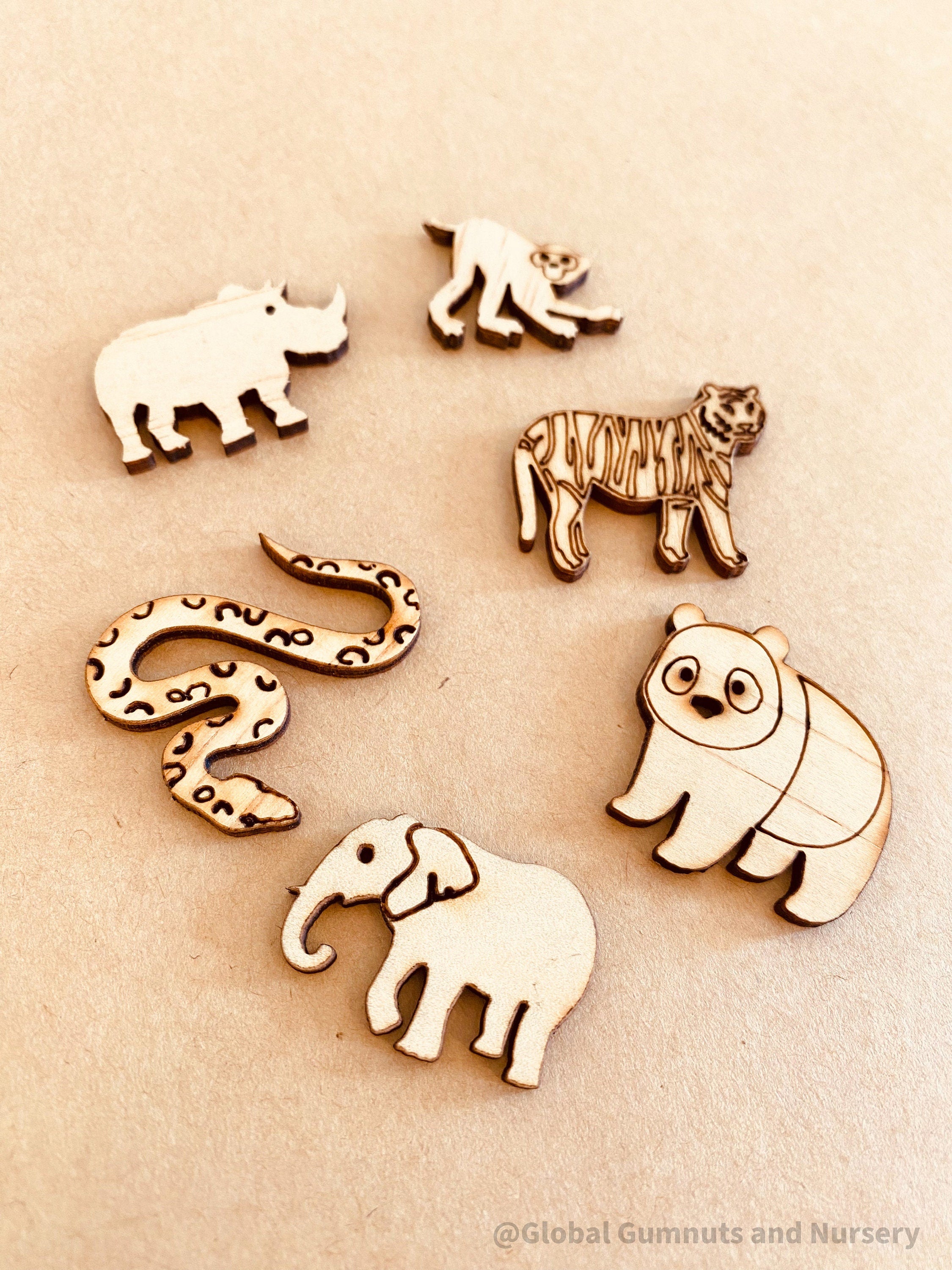 Wild Animal Embellishments: Set of six wooden exotic animal decorations.
