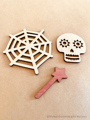 Halloween Embellishments Set: Halloween-themed wooden decorations including spiders and skulls.