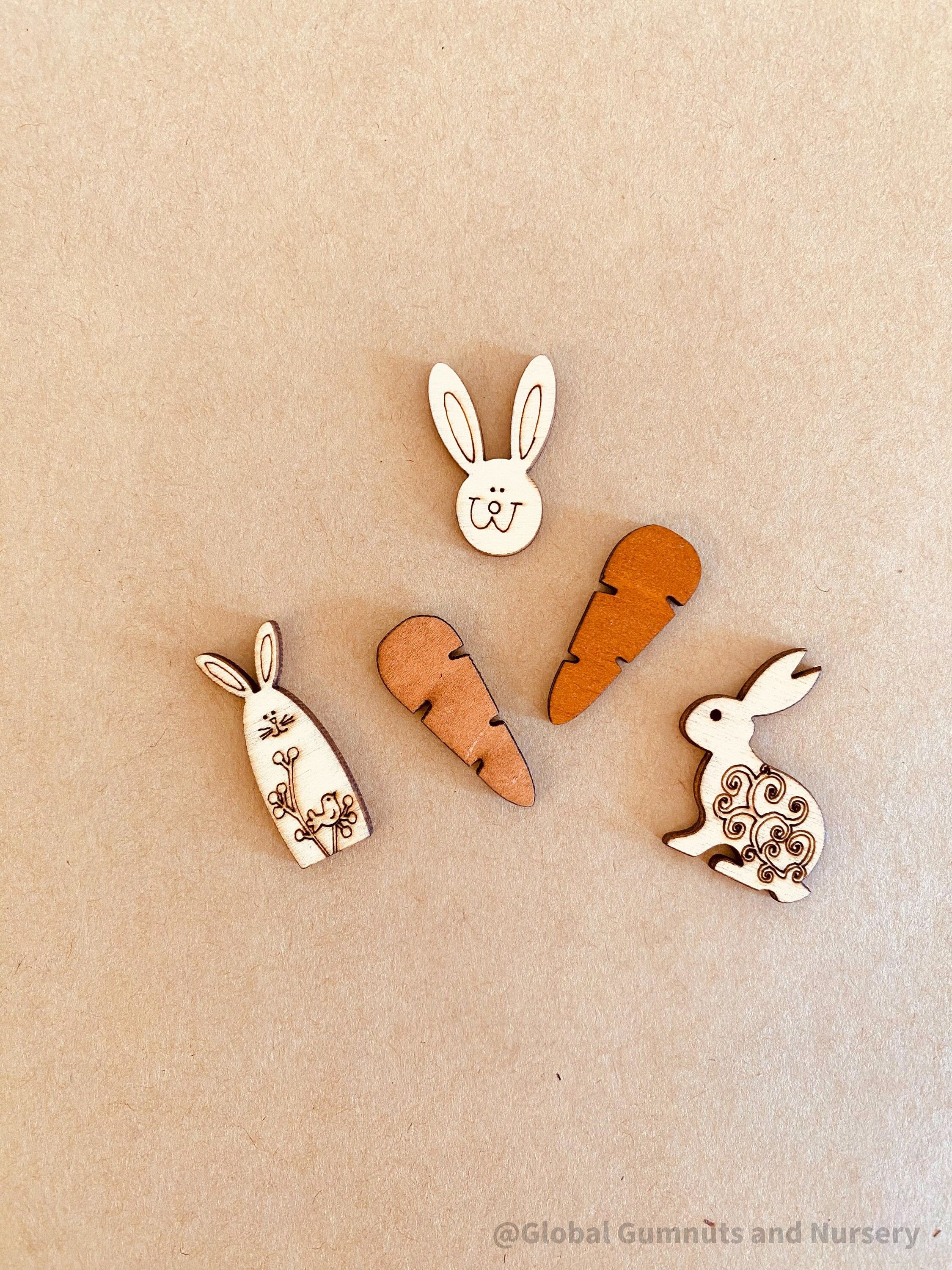 Easter Wooden Embellishments: Set of three bunnies and two carrots for Easter-themed crafts.