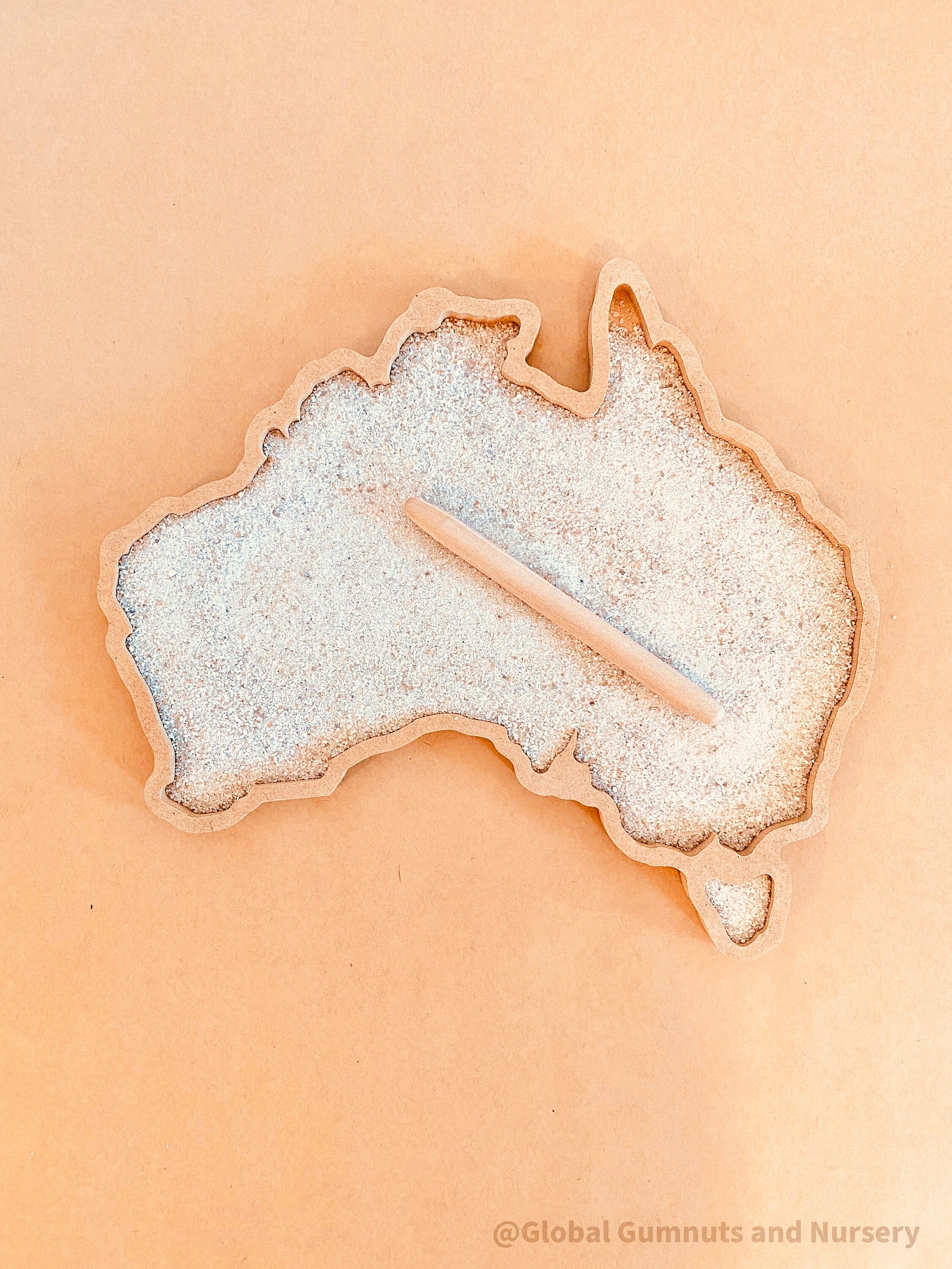 Sensory wonderland with the Australia tray, includes drawing pencil and sand.