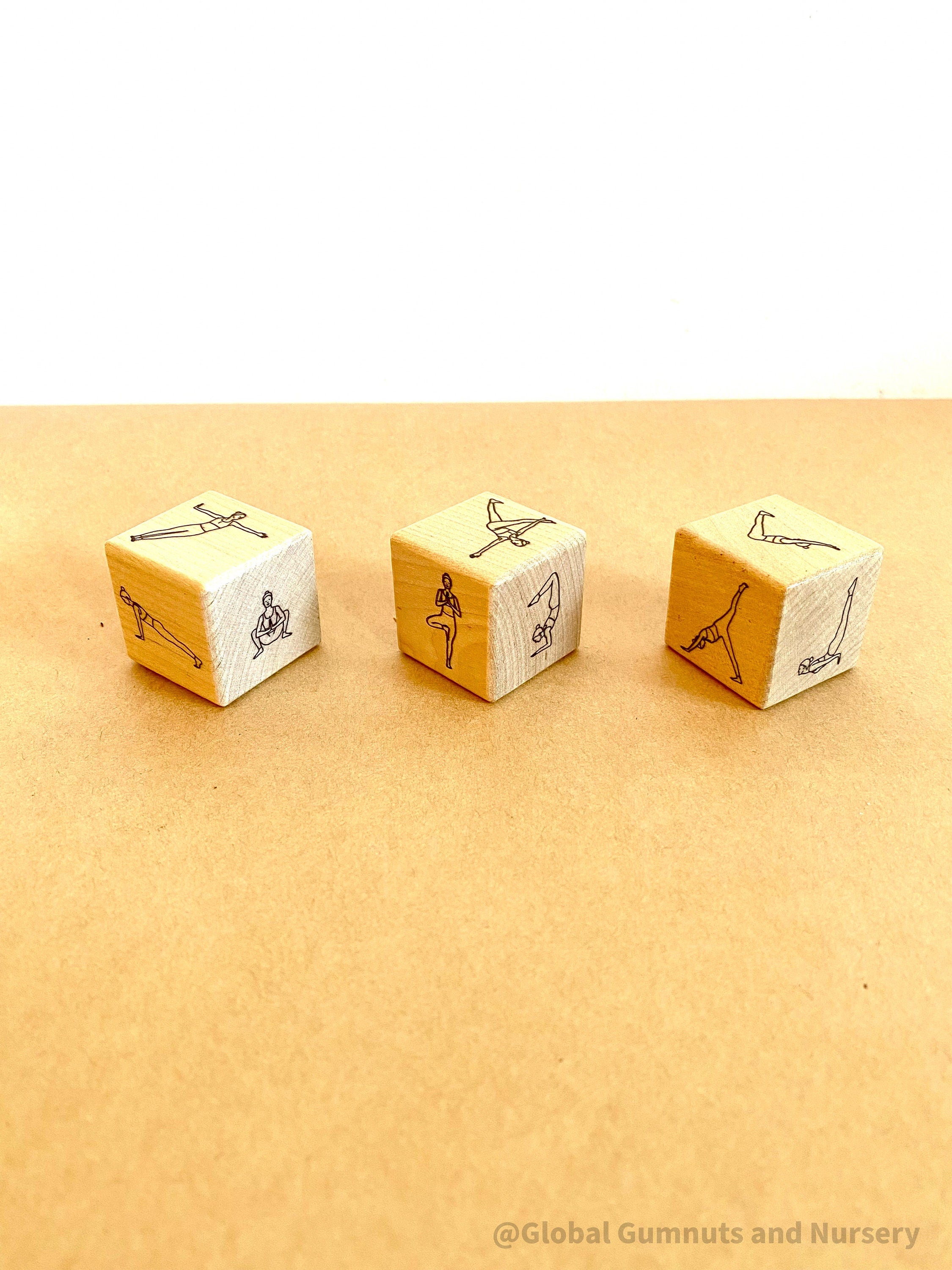 Wooden yoga dice set for discovering yoga poses in a fun, interactive way. Great for mindfulness and movement!