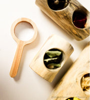 Kids' wooden magnifier, perfect for exploring nature and sparking curiosity in young adventurers.
