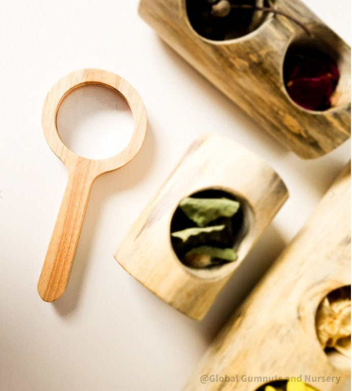Kids' wooden magnifier, perfect for exploring nature and sparking curiosity in young adventurers.