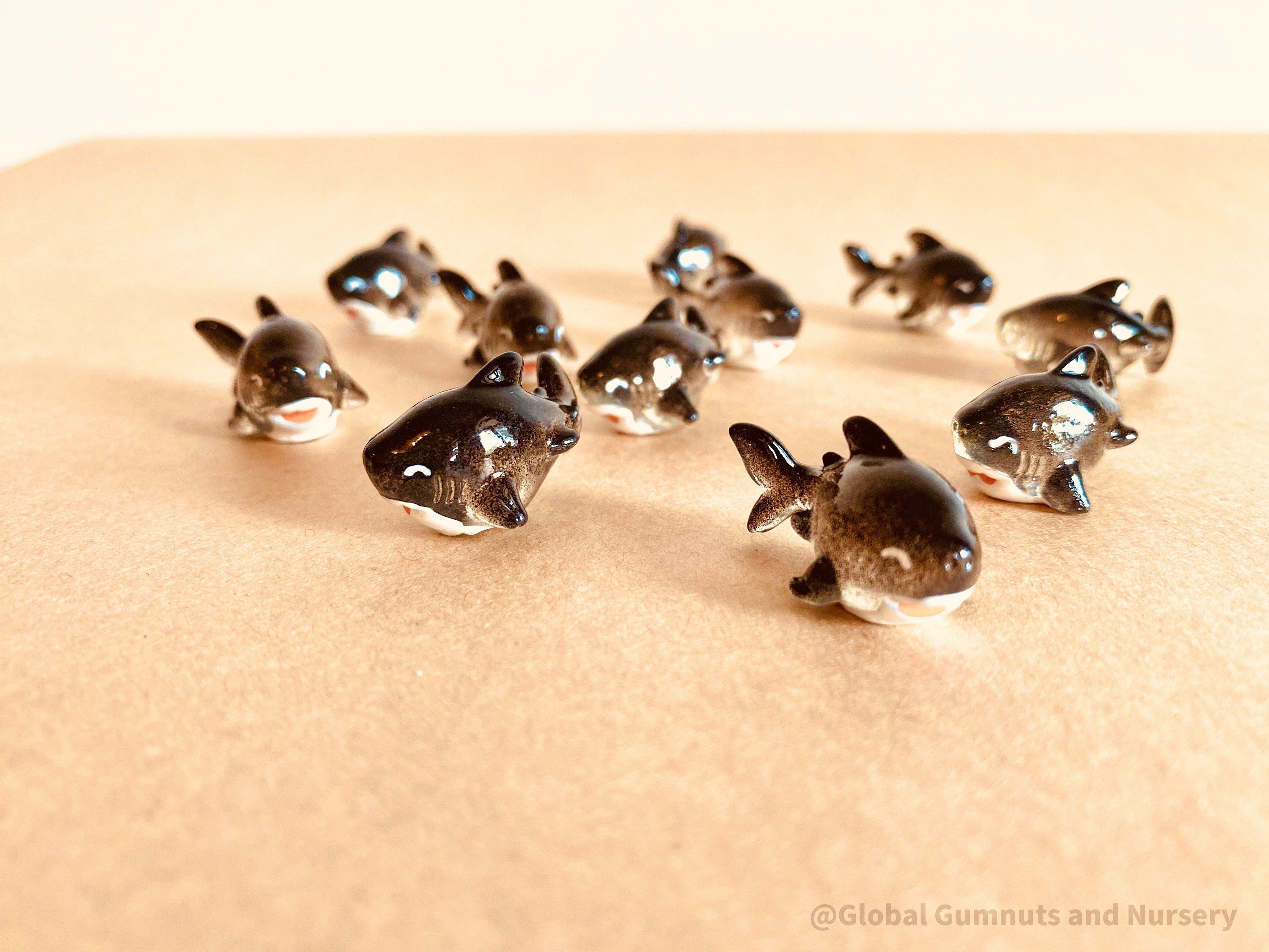 Tiny Resin Black Sharks: Miniature black resin sharks, perfect for arts, crafts, cake toppers, and fairy garden decorations.
