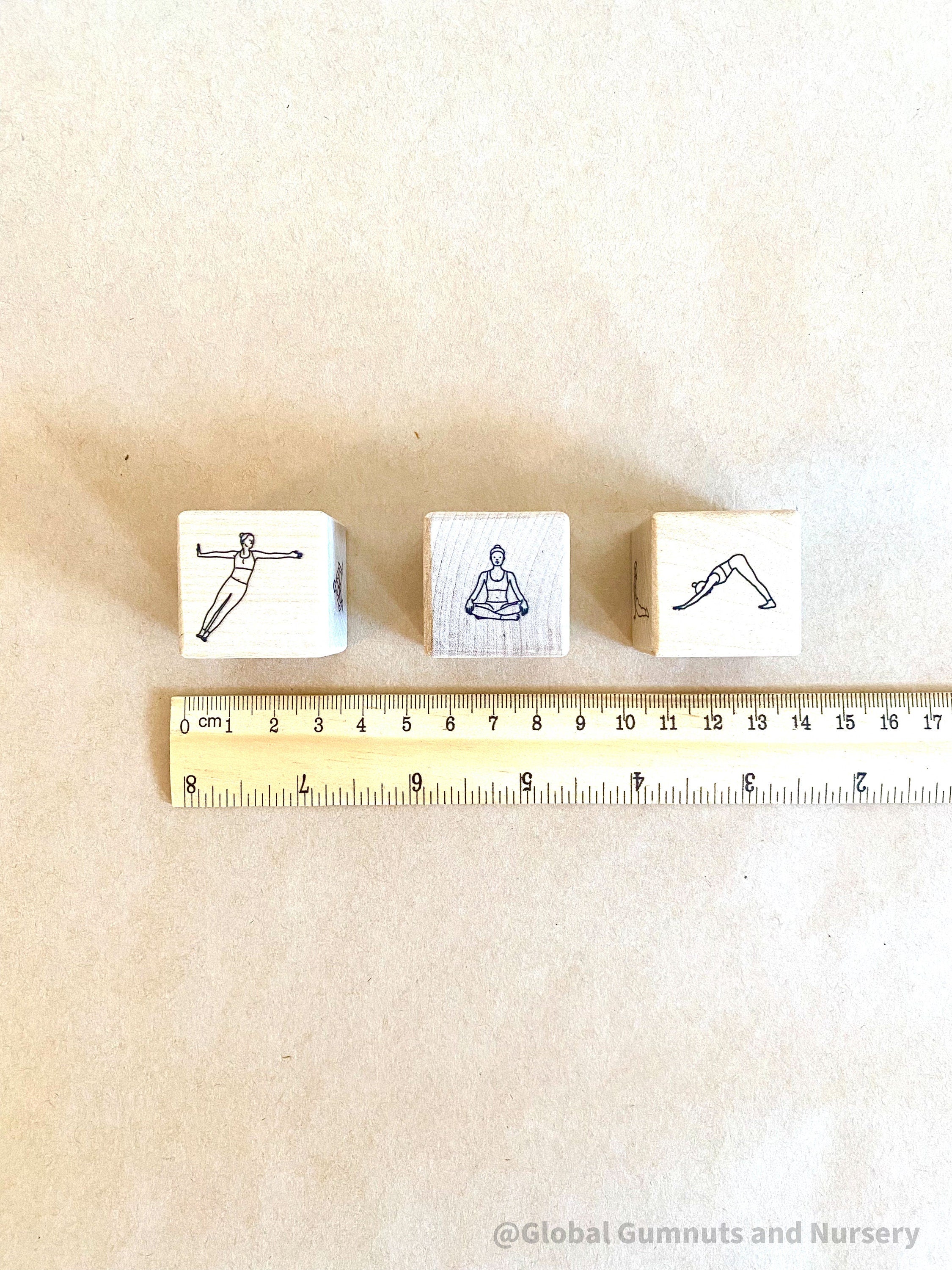Wooden yoga dice set for discovering yoga poses in a fun, interactive way. Great for mindfulness and movement!