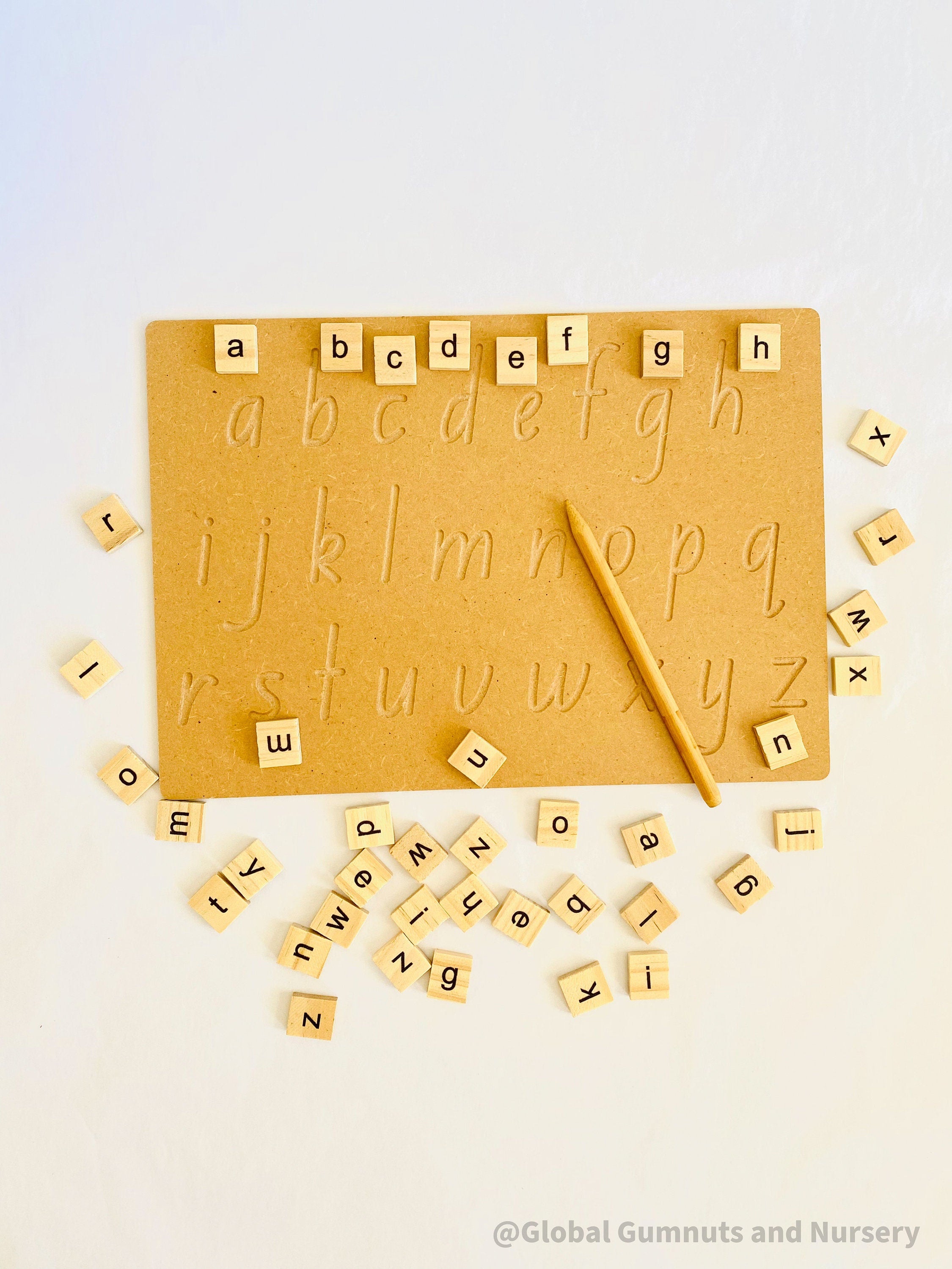 Lowercase Wooden Tracing Board: Board and stylus for letter tracing and writing practice.