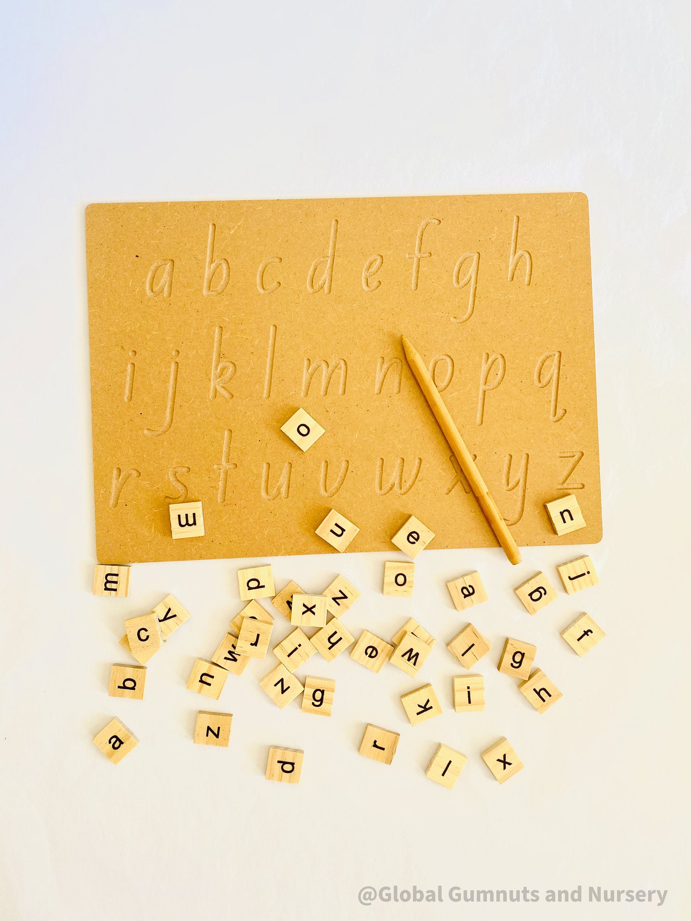 Lowercase Wooden Tracing Board: Board and stylus for letter tracing and writing practice.