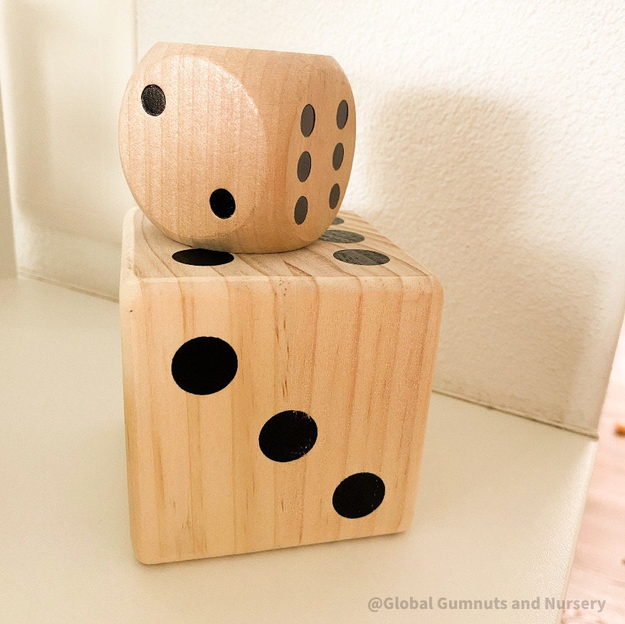 Oversized wooden dice, perfect for garden games, party entertainment, or creative displays.
