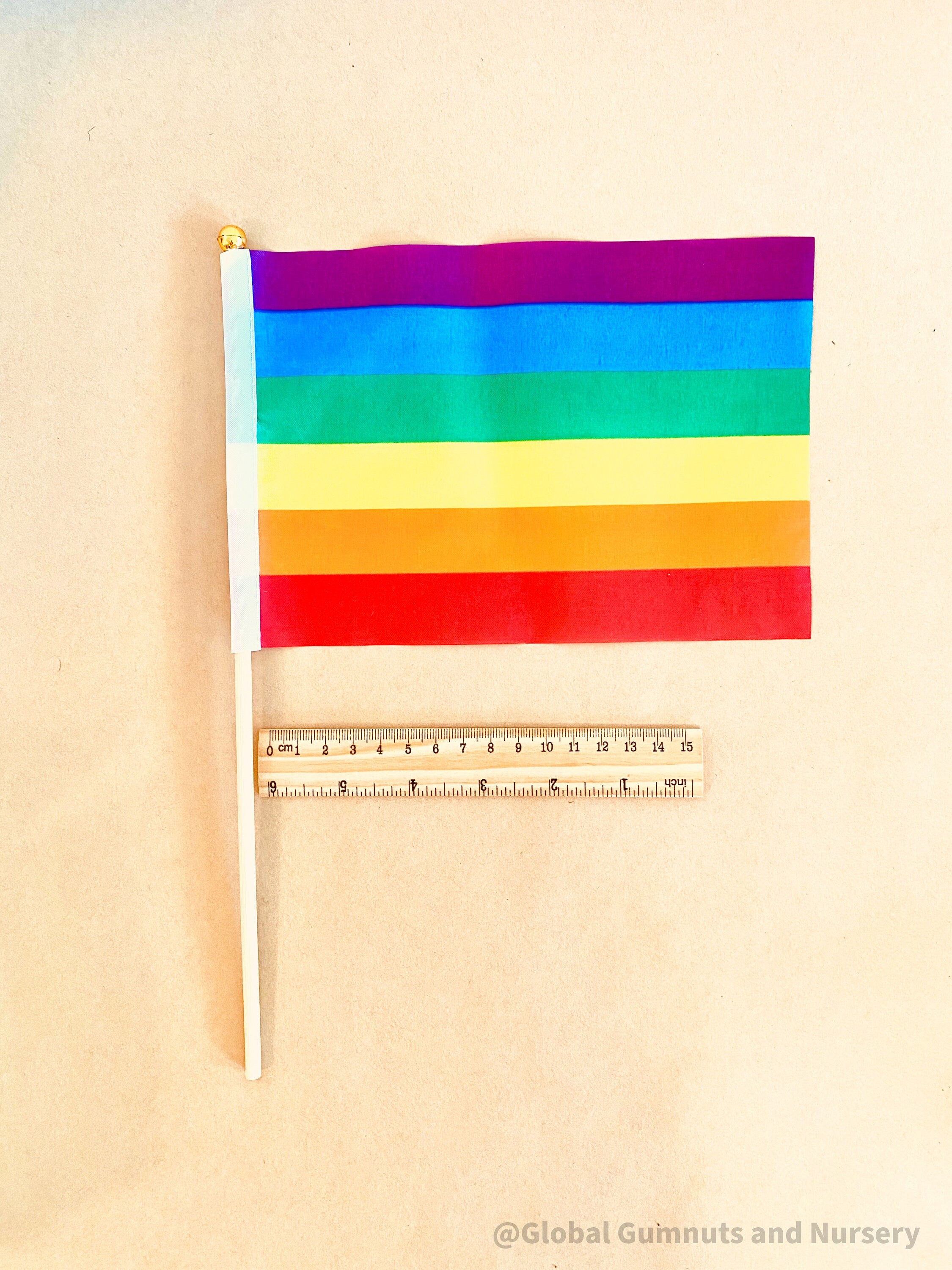 Australian Flag on Wooden Pole: Aboriginal and Australian flag set with optional felt balls.