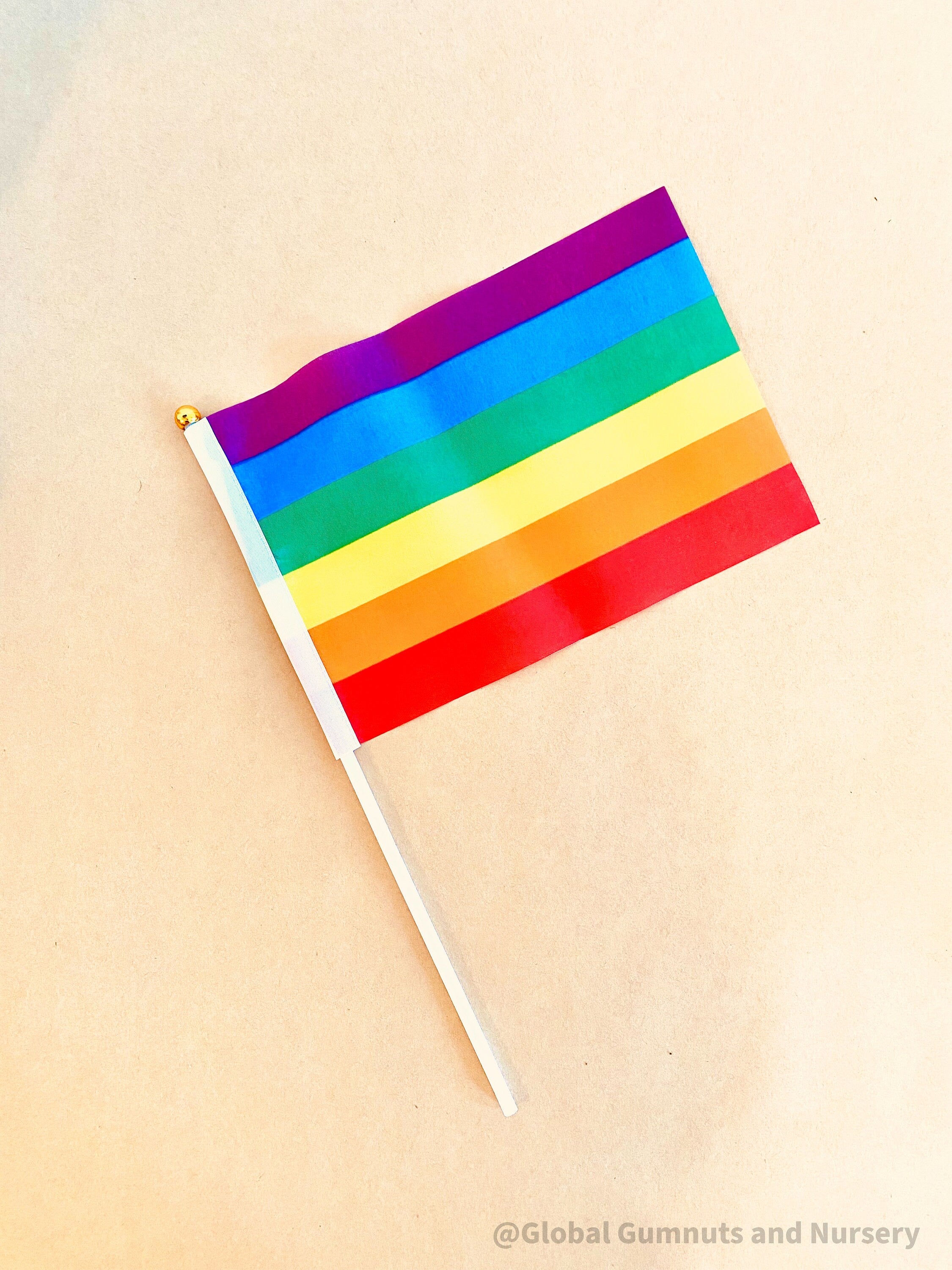 Australian Flag on Wooden Pole: Aboriginal and Australian flag set with optional felt balls.
