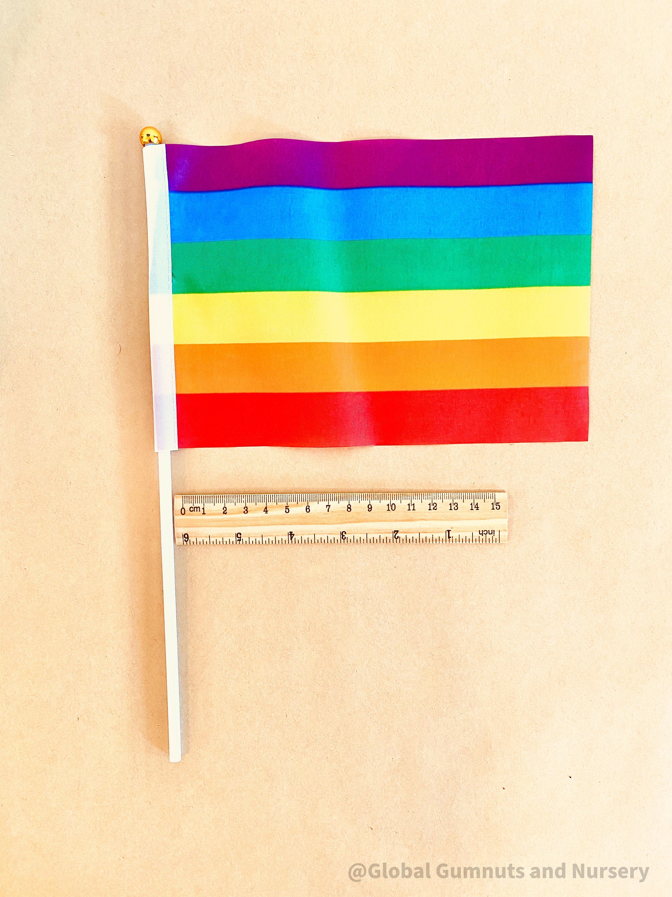 Australian Flag on Wooden Pole: Aboriginal and Australian flag set with optional felt balls.
