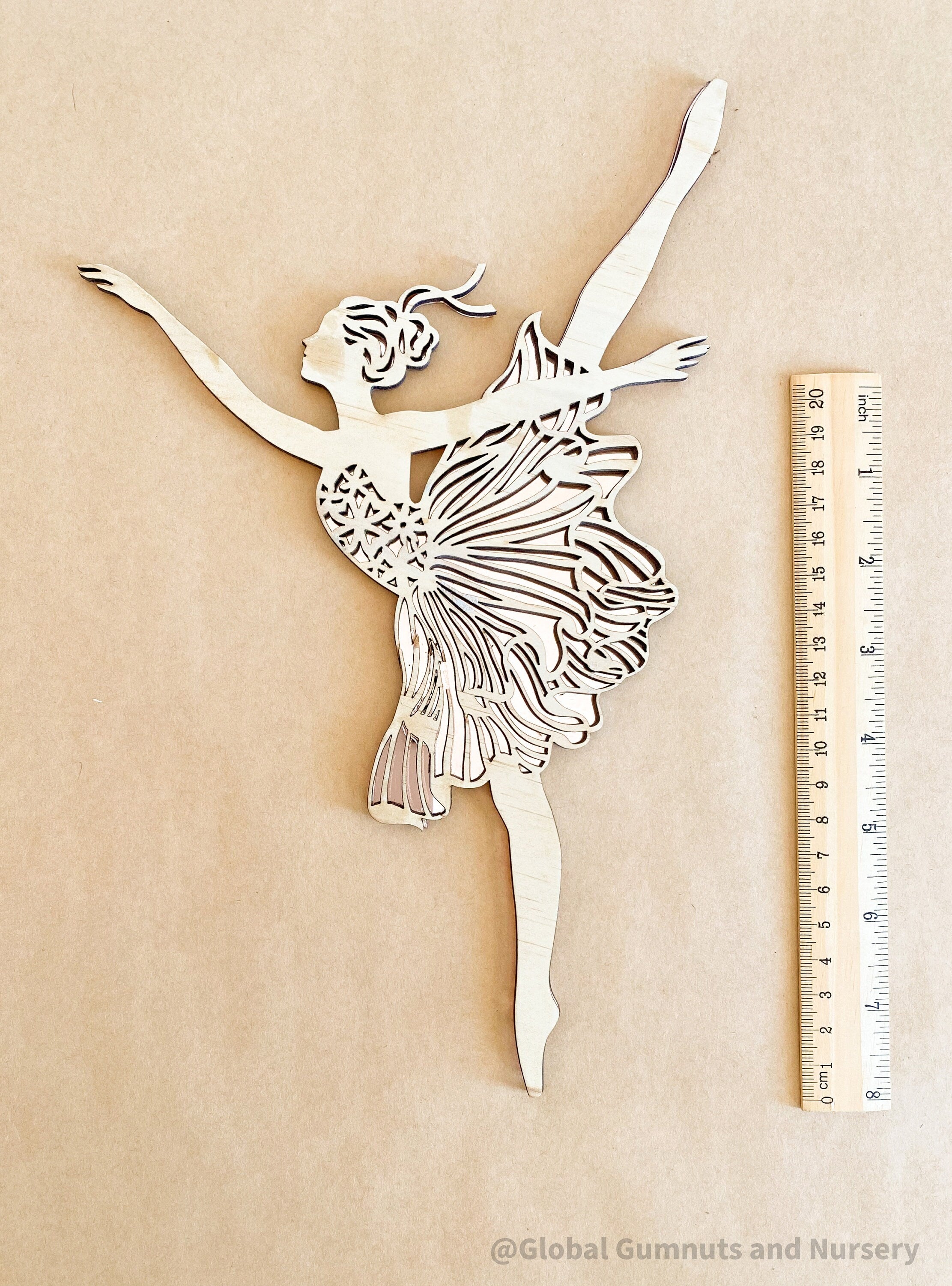 Set of three wooden ballerinas with rose gold backing, elegant wall decor for girls' bedrooms.