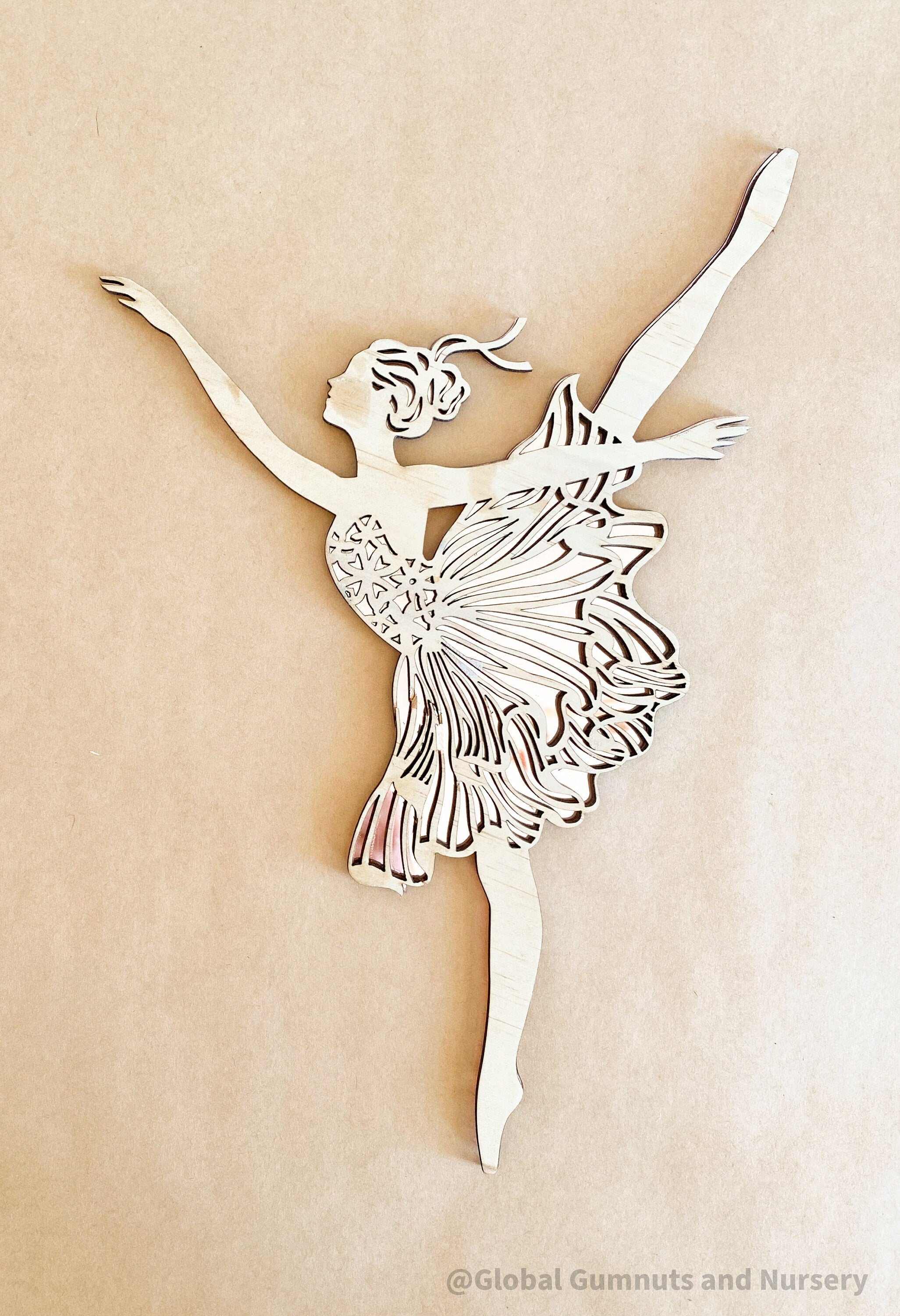 Set of three wooden ballerinas with rose gold backing, elegant wall decor for girls' bedrooms.