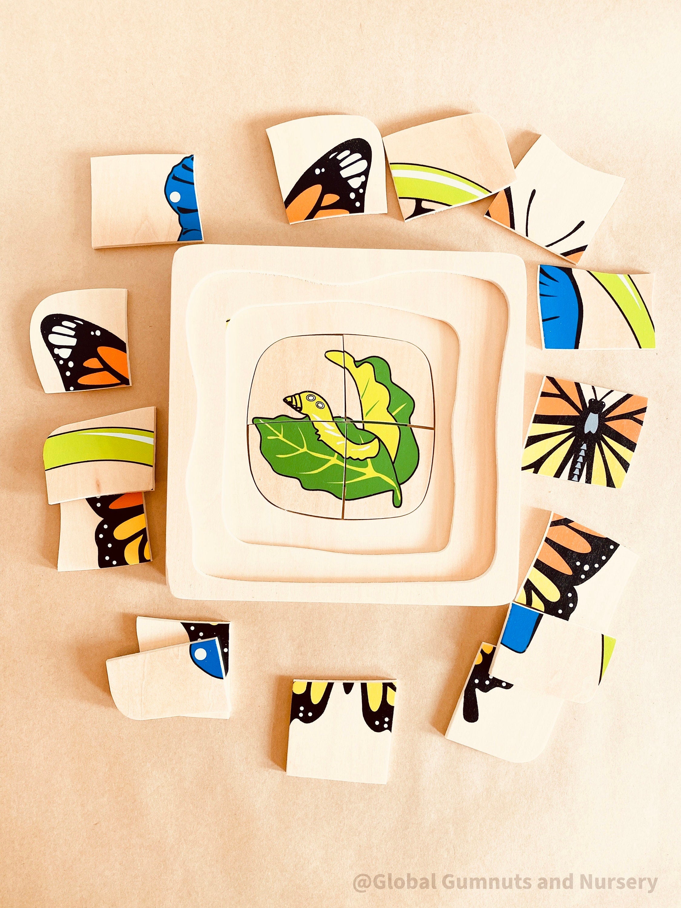Butterfly life cycle puzzle, Montessori-inspired and crafted as a square educational toy. Perfect for learning and play.