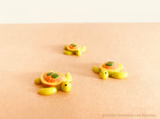 mini turtle figurine: adorable mini resin turtle for creative play or display.