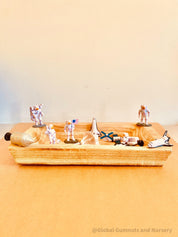 11-piece plastic space explorer figurine set with astronauts, rockets, and space vehicles. Inspires imaginative play and learning about the cosmos!