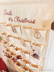 Linen Advent Calendar: Advent calendar with wooden numbers and festive design.