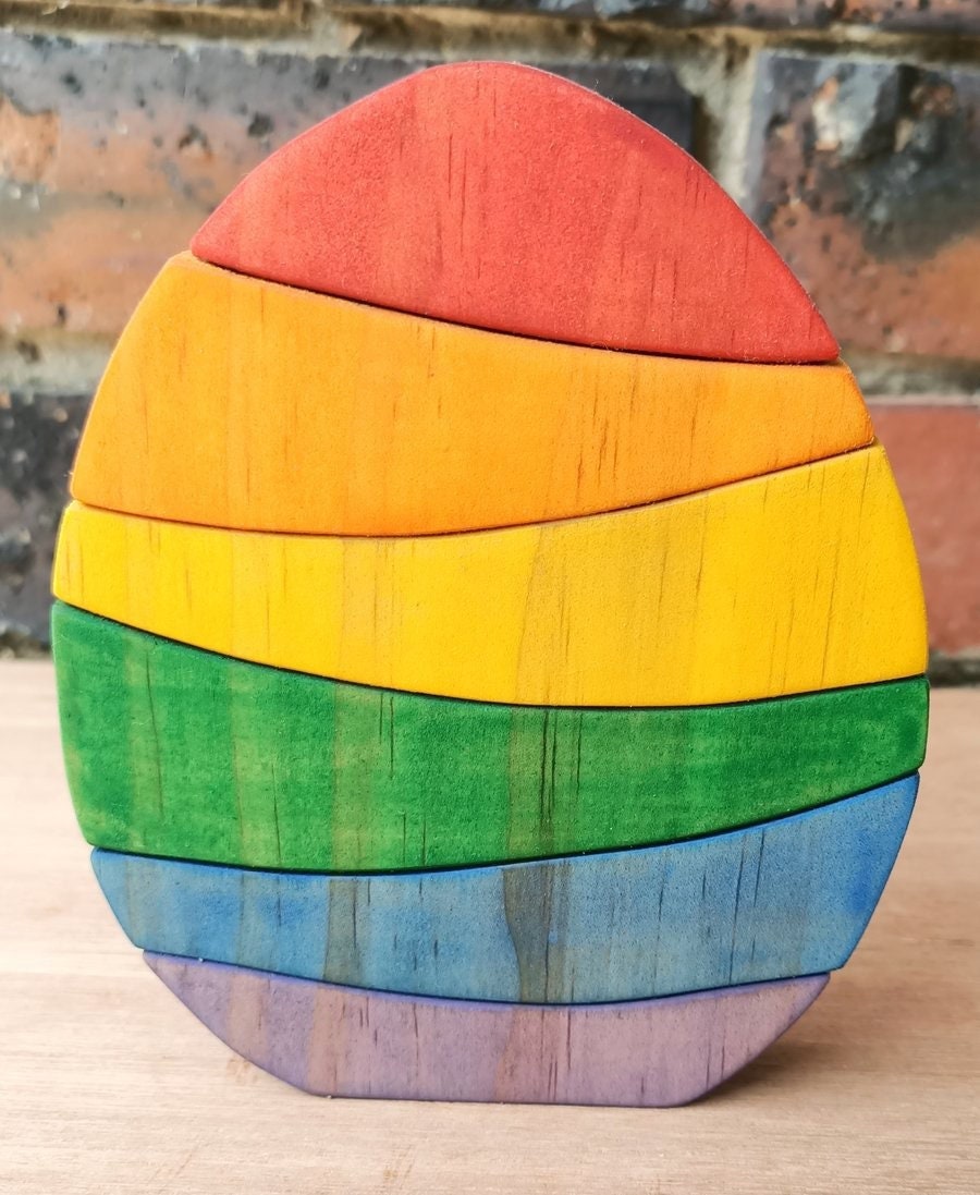 Rainbow Egg Wooden Stacker: Colourful egg-shaped stacker toy.