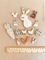 Easter Wooden Embellishments Set: 14 festive wooden pieces for Easter crafts.
