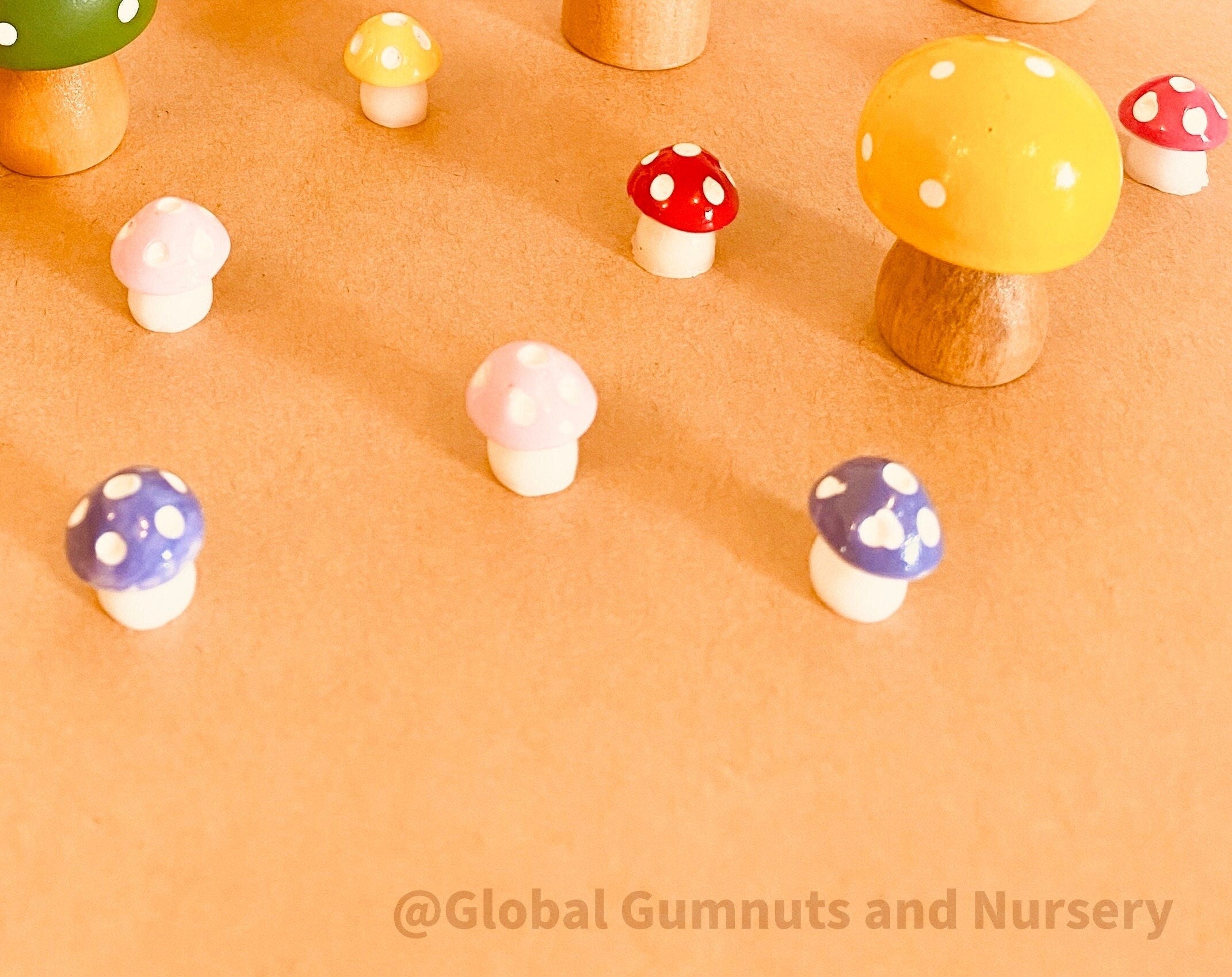 Colourful Resin Mushrooms: Vibrant resin mushroom set for fairy gardens or plant decor.