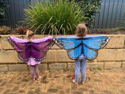 Vibrant butterfly wings for kids, custom chiffon designs with glitter and sparkle, perfect for dress-up or dance.